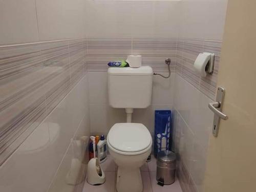 a bathroom with a white toilet in a room at Apartment Korzo - Two Bedroom apartment in Bjelovar