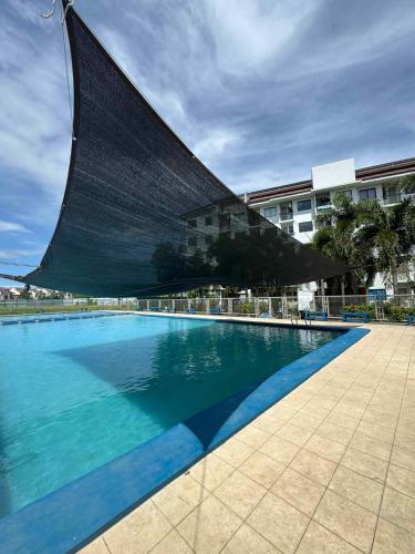 a large swimming pool in front of a building at Casa En El Sur in Santa Rosa
