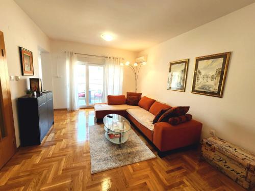 a living room with a couch and a table at Apartment Bella Vista in Trebinje