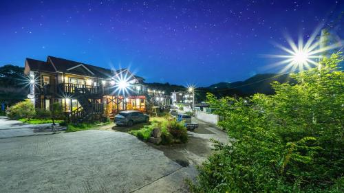 a house with a car parked in a driveway at night at Gyeongju Byeolgwadaliyagi Dog-friendly pension in Gyeongju