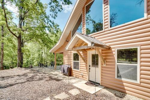 a log cabin with a front door and a driveway at Sip, Hike and Explore Sleek Retreat in Cleveland! in Cleveland