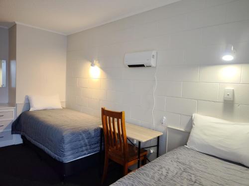 Postel nebo postele na pokoji v ubytování Continental Motel