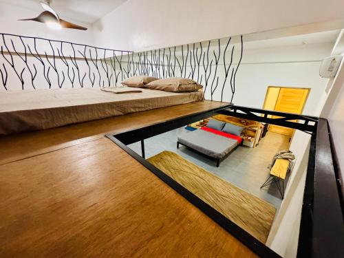Ένα ή περισσότερα κρεβάτια σε δωμάτιο στο The Lofts Siquijor