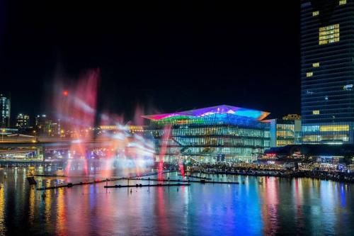 a city with a fountain in the water at night at Peaceful & Central Stay in Liverpool - Private Double Room - Shared Bathroom in Liverpool