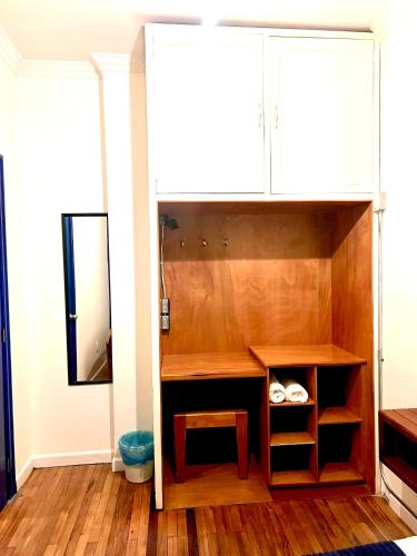 a bathroom with a vanity and a mirror at Community Hostel Quito in Quito