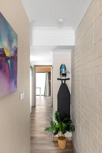 a hallway with a white brick wall at Smart Stay with Convenience - Private Single Room in Liverpool - Shared Bathroom in Liverpool