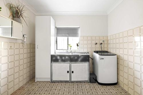 a small kitchen with a sink and a window at Smart Stay with Convenience - Private Single Room in Liverpool - Shared Bathroom in Liverpool
