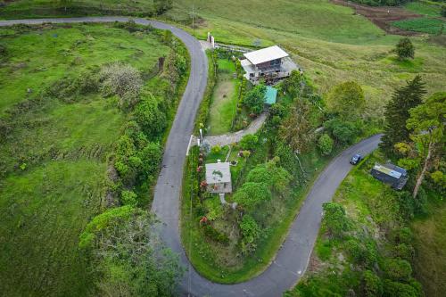an aerial view of a winding road in a field at Loft con hermosas vistas y Volcán Turrialba in Turrialba