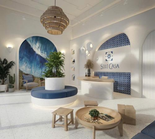 a lobby with a table and chairs in a room at Sole Casa Phu Quoc in Phu Quoc