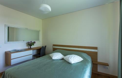 Katil atau katil-katil dalam bilik di Violetos Lux Apartamentai