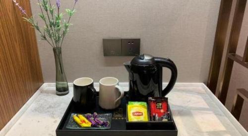 Yitel Collection Harbin Railway Station Museum Metro Stationにあるコーヒーまたはお茶