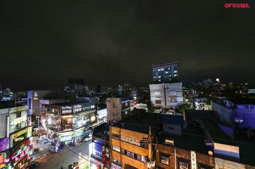 a view of a city at night with buildings at Yeongdeungpo Station New York Hotel in Seoul