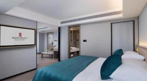 a bedroom with a large bed and a bathroom at Nanning Prince Hotel in Nanning