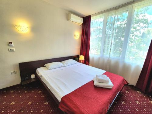 Postel nebo postele na pokoji v ubytování Hotel Marie