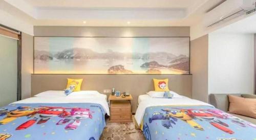 a bedroom with two beds with cars on them at Guilin Manhatton Hotel Tianjie in Guilin