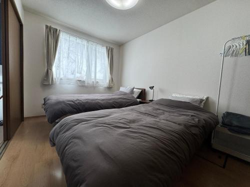 Postel nebo postele na pokoji v ubytování Stay ABASHIRI BAY