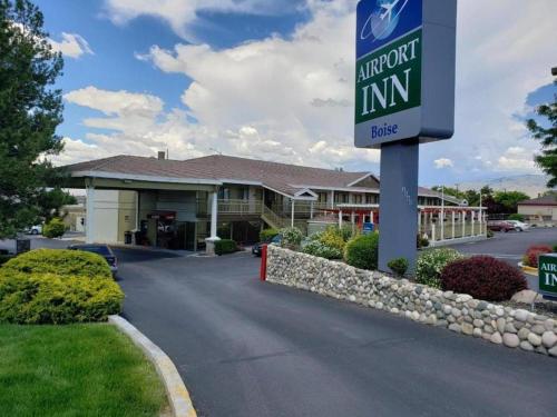 a sign for an indoor inn in front of a building at Airport Inn in Boise