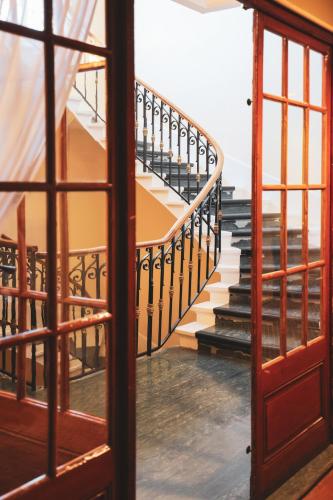 a view of a staircase through a window at Best Western Grand Hotel de Paris & Spa in Villard-de-Lans