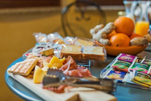 a table topped with a plate of cheese and bread at Pedrales Orgosolo in Orgosolo