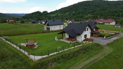 an aerial view of a house in a field at Rajderówka in Krzyżowa