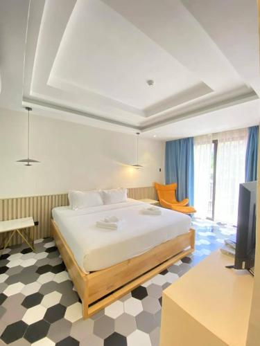 Un ou plusieurs lits dans un hébergement de l'établissement Only Seed Resort 欧芮希度假酒店