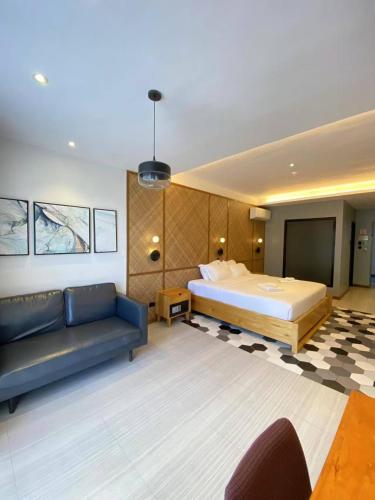 Un ou plusieurs lits dans un hébergement de l'établissement Only Seed Resort 欧芮希度假酒店