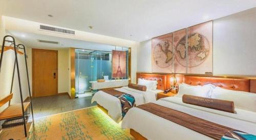 a hotel room with two beds and a bathroom at James Joyce Coffetel·Shijiazhuang Economic and Technological Development Zone Chuangye Road in Shijiazhuang