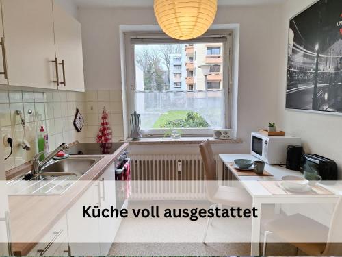 a kitchen with a sink and a window at FeWo Berg-Domizil Bad Harzburg mit eigenem Fahrradkeller und Parkplatz, inklusive Bettwäsche und Handtüchern in Bad Harzburg