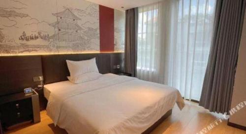 Ένα ή περισσότερα κρεβάτια σε δωμάτιο στο 7 Days Inn Deyang Zhongjiang Kuishan Park