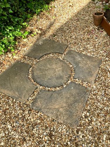 a stone walkway with a circle in the middle at Lorton Villa with a Log Burner in Saint Helens