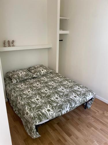 En eller flere senge i et værelse på Petit nid douillet centre-ville