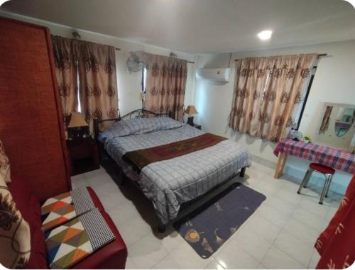 a bedroom with a bed and a couch at FRONT BEACH FISHER HOUSE BANGPOR BEACH MAENAM-Koh Samui in Amphoe Koh Samui