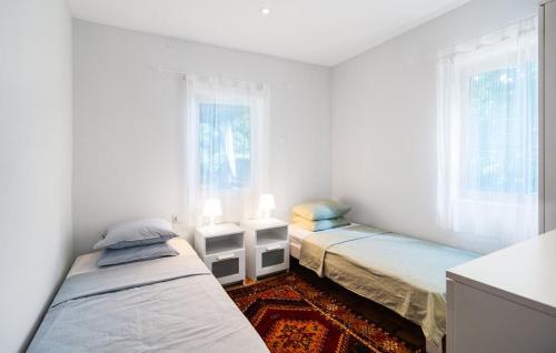 Giường trong phòng chung tại Holiday home - Villa Bianca