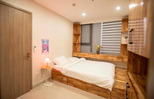 Postel nebo postele na pokoji v ubytování MILY APARTMENT- NERA Garden 2 - Hue