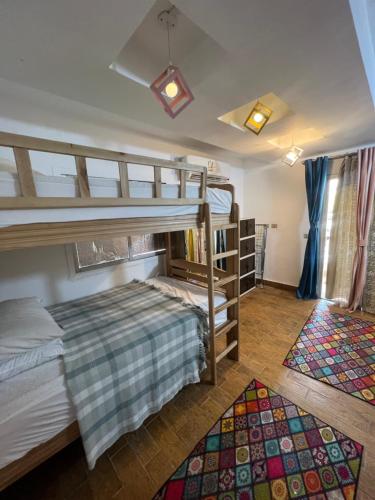 Postel nebo postele na pokoji v ubytování Cozy Apartment