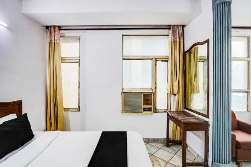 Postel nebo postele na pokoji v ubytování Hotel O Iconic Residency