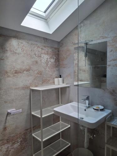 a bathroom with a sink and a mirror at Celina Villa Tina in Celina