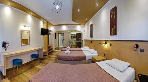 Postel nebo postele na pokoji v ubytování Hotel Marilena