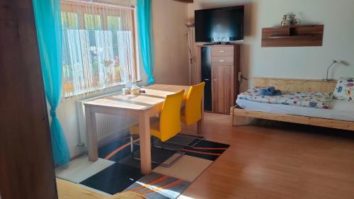 a small room with a table and a bed at Holiday Apartment Murtal in Judenburg
