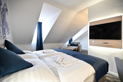Postel nebo postele na pokoji v ubytování Hotel Merlot