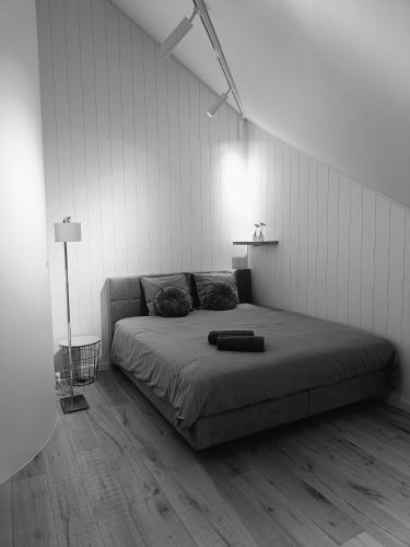a bedroom with a large bed in a white room at B6 in Ursel