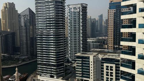 an aerial view of a city with tall buildings at TGB Manchester Holidays JBR Marina in Dubai
