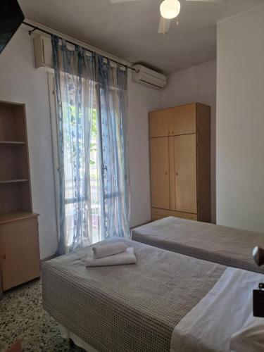Postel nebo postele na pokoji v ubytování Hotel AnnaMare
