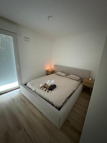 Ένα ή περισσότερα κρεβάτια σε δωμάτιο στο Appartement luxueux à 4 minutes de l'aéroport de genève