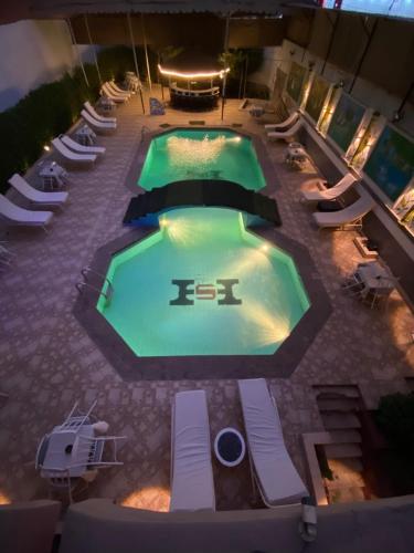an overhead view of a swimming pool at night at Shady Hotel Luxor in Luxor