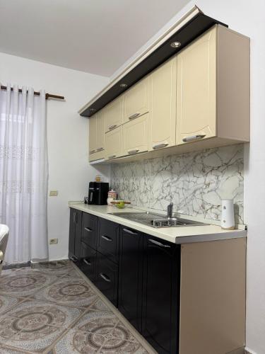 Kuchyň nebo kuchyňský kout v ubytování Sea You Soon Apartment