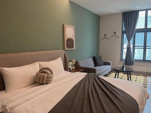 Ένα ή περισσότερα κρεβάτια σε δωμάτιο στο Minilove Homestay