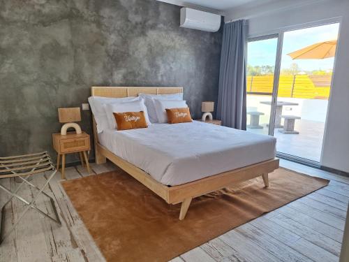 Ένα ή περισσότερα κρεβάτια σε δωμάτιο στο Central Lava 27 Apartment