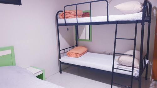 Кровать или кровати в номере Dreaming Hostel Sinchon Hongdae