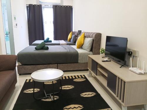 a living room with a bed and a tv at Core Soho Suit Kip Sentral Kotawarisan Family Studio Near KLIA & KLIA2 in Sepang